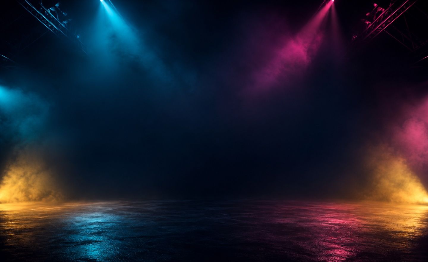 A stage lit in cyan, magenta and amber